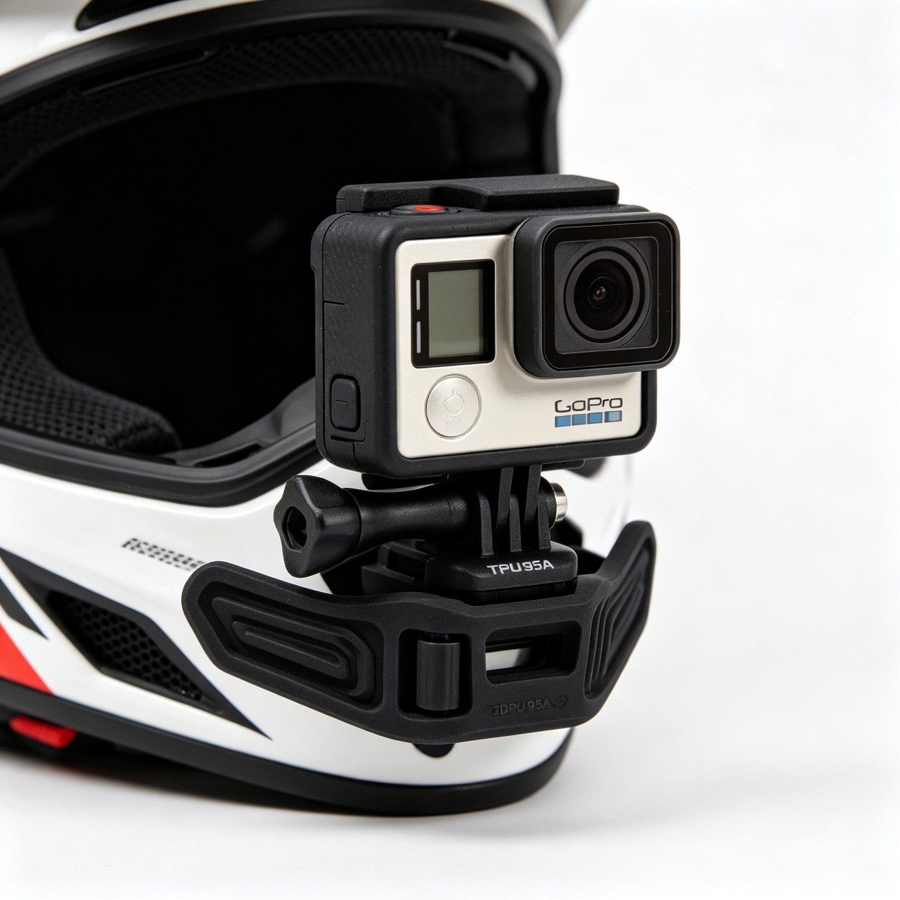 A motorcycle helmet chin mount in TPU 95A. Flexible structure that hugs the helmet curve, with a quick-release latch for POV footage.