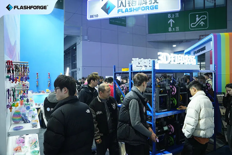 Attendees watching live 3D print demo at Flashforge trade show booth