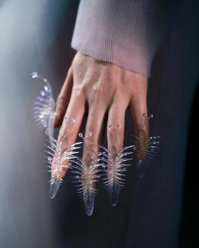 3D-printed feather-structure nails at Iris van Herpen couture show