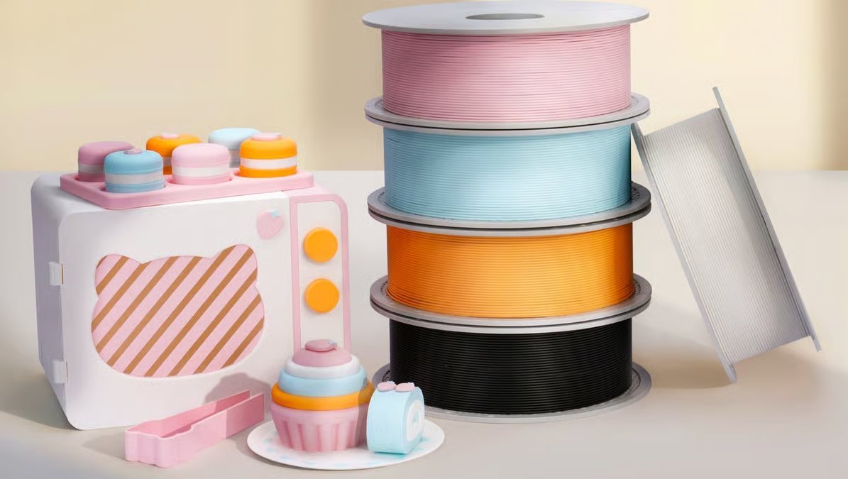 Bambu Lab PLA Pure filament spools in multiple colors with 3D printed sample parts